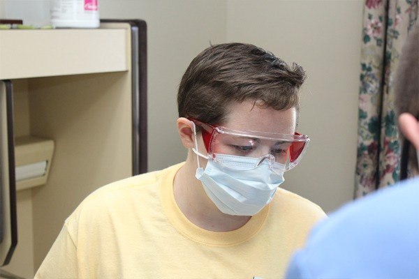 Closeup of dental team member concentrating on patient